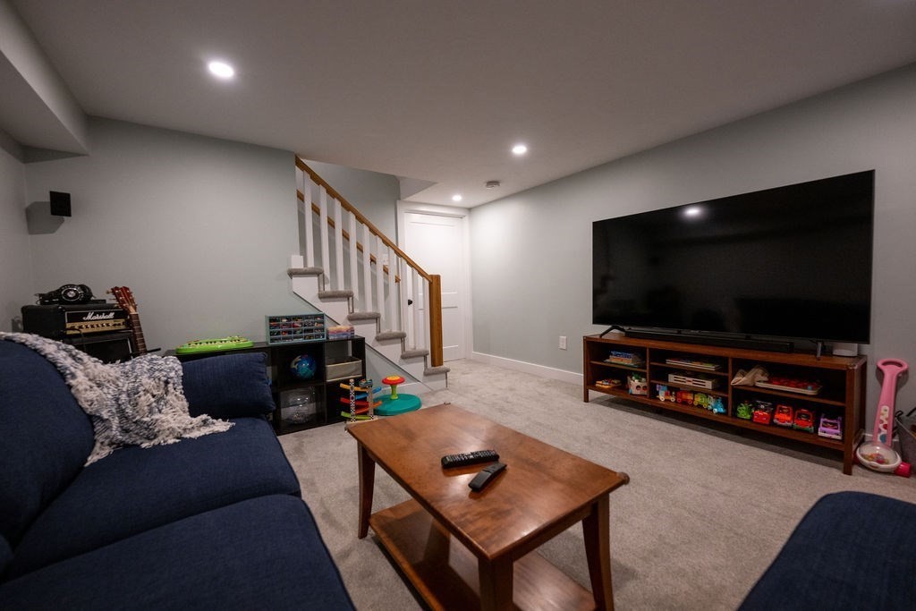 18 Belmore Road Natick, MA 01760 - Photo 30 of 30 a living room with furniture and a flat screen tv