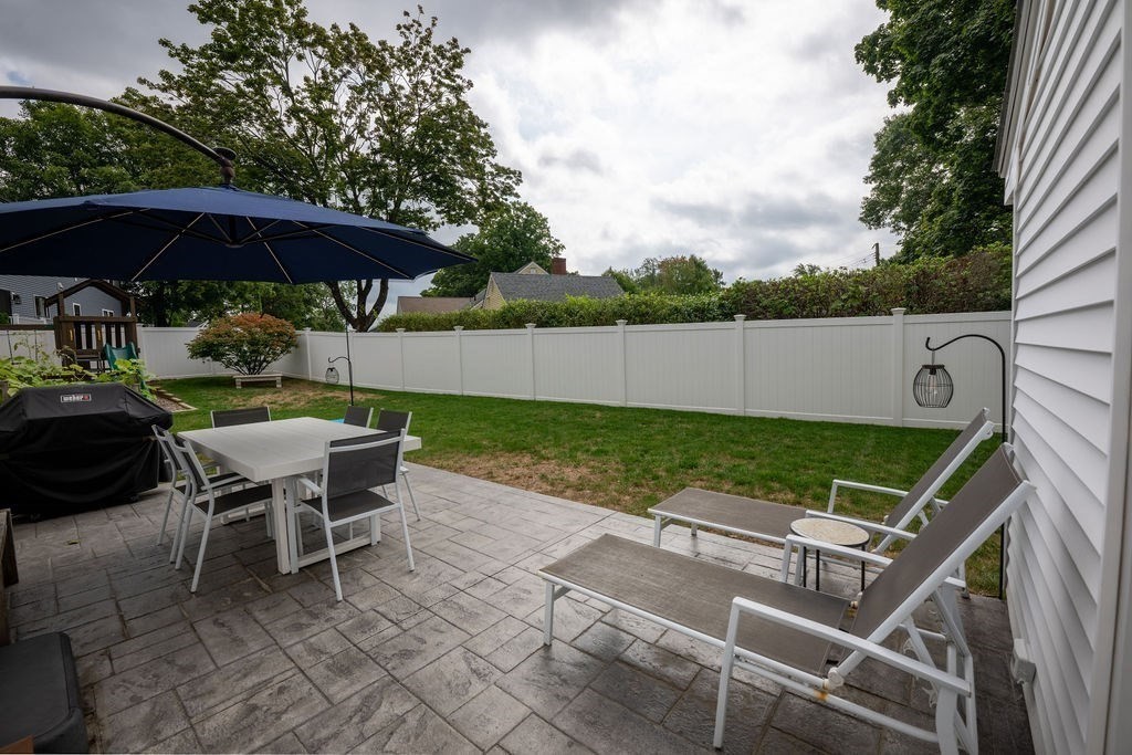 18 Belmore Road Natick, MA 01760 - Photo 4 of 30 a view of yard with seating area