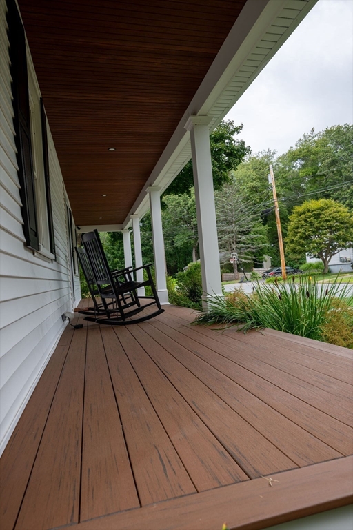 18 Belmore Road Natick, MA 01760 - Photo 6 of 30 a view of backyard with hardwood and deck