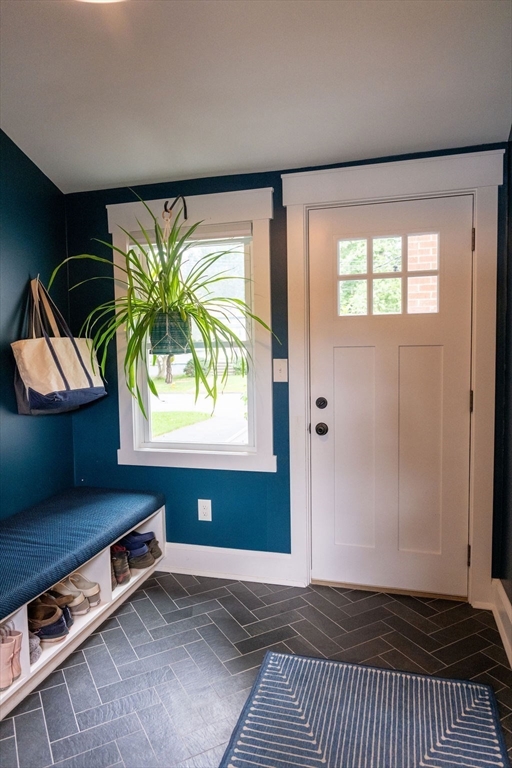18 Belmore Road Natick, MA 01760 - Photo 8 of 30 a view of an empty room with window and a kitchen