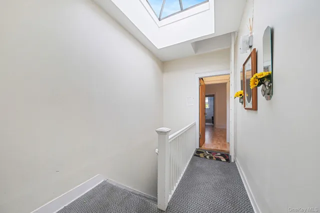 a view of a hallway view with staircase