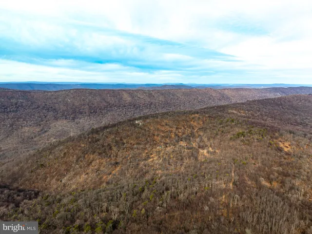 a view of an ocean and mountain