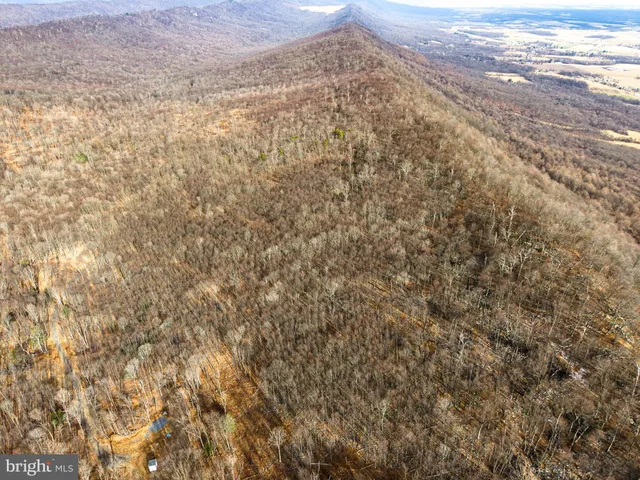 a view of a field with an outdoor space