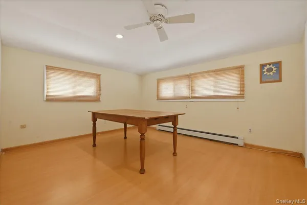 a view of a room with furniture and a window