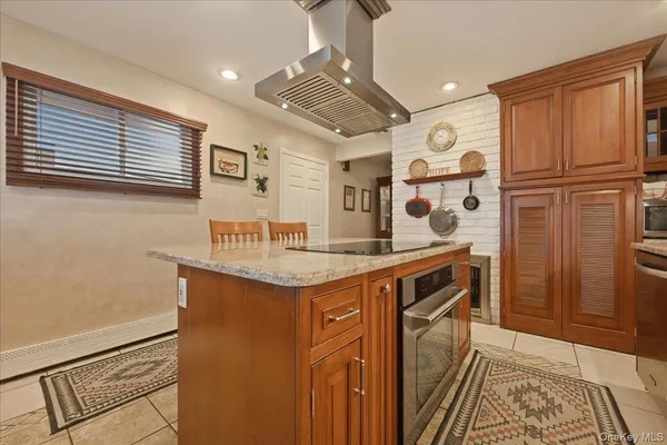 a kitchen with granite countertop a sink and cabinets
