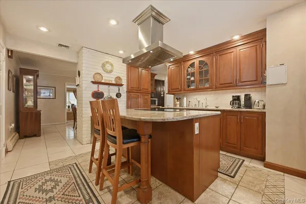 a kitchen with stainless steel appliances granite countertop a refrigerator and microwave