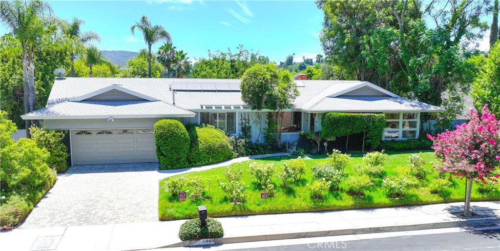 a view of a garden with a patio