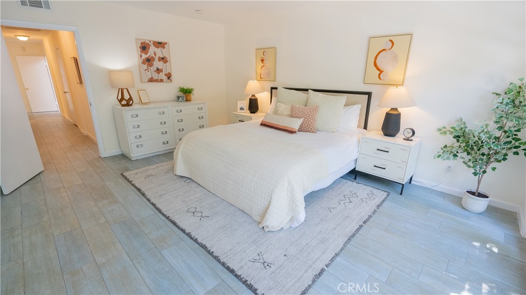 4669 Arriba Drive Tarzana, CA 91356 - Photo 14 of 22 a bedroom with a bed and a couch