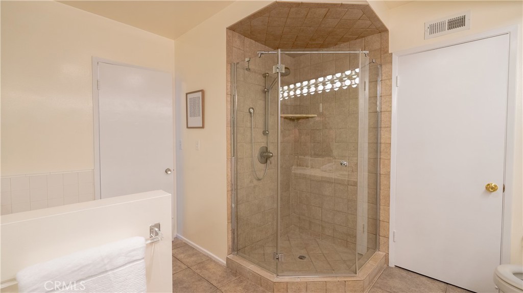 4669 Arriba Drive Tarzana, CA 91356 - Photo 17 of 22 a bathroom with a shower