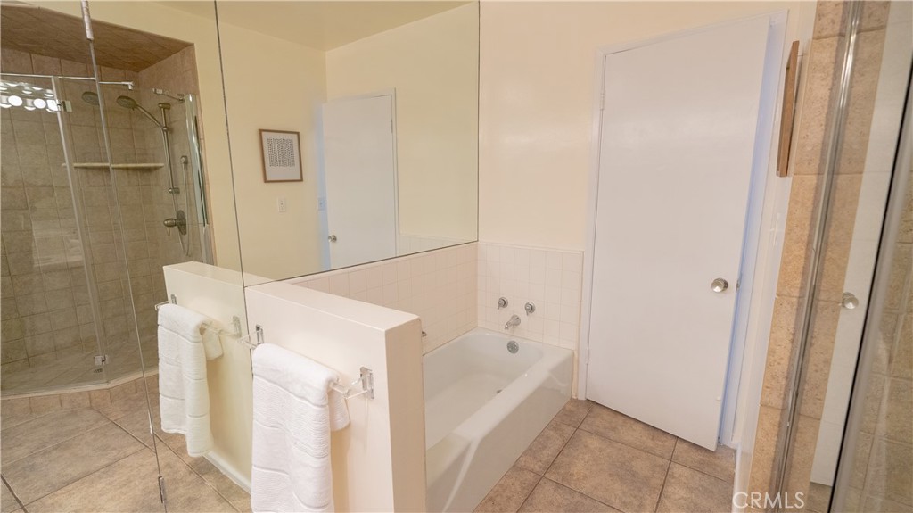 4669 Arriba Drive Tarzana, CA 91356 - Photo 19 of 22 a bathroom with a bathtub and shower