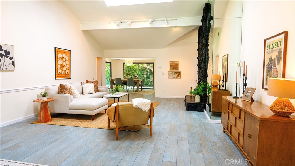 4669 Arriba Drive Tarzana, CA 91356 - Photo 3 of 22 a living room with furniture and a large window