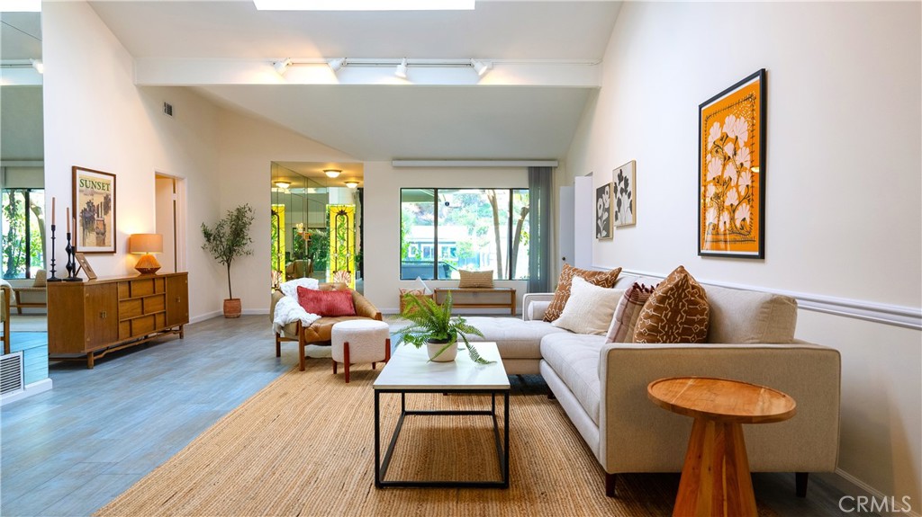 4669 Arriba Drive Tarzana, CA 91356 - Photo 4 of 22 a living room with furniture and a large window