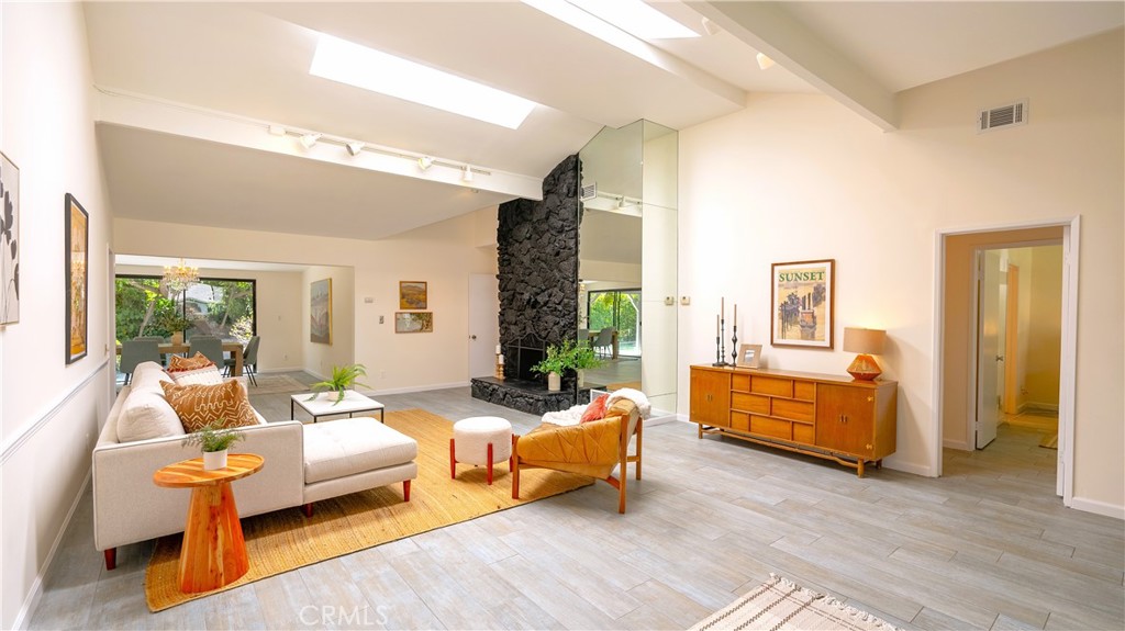 4669 Arriba Drive Tarzana, CA 91356 - Photo 5 of 22 a bedroom with furniture and wooden floor