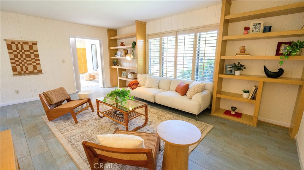 4669 Arriba Drive Tarzana, CA 91356 - Photo 8 of 22 a living room with furniture and a window