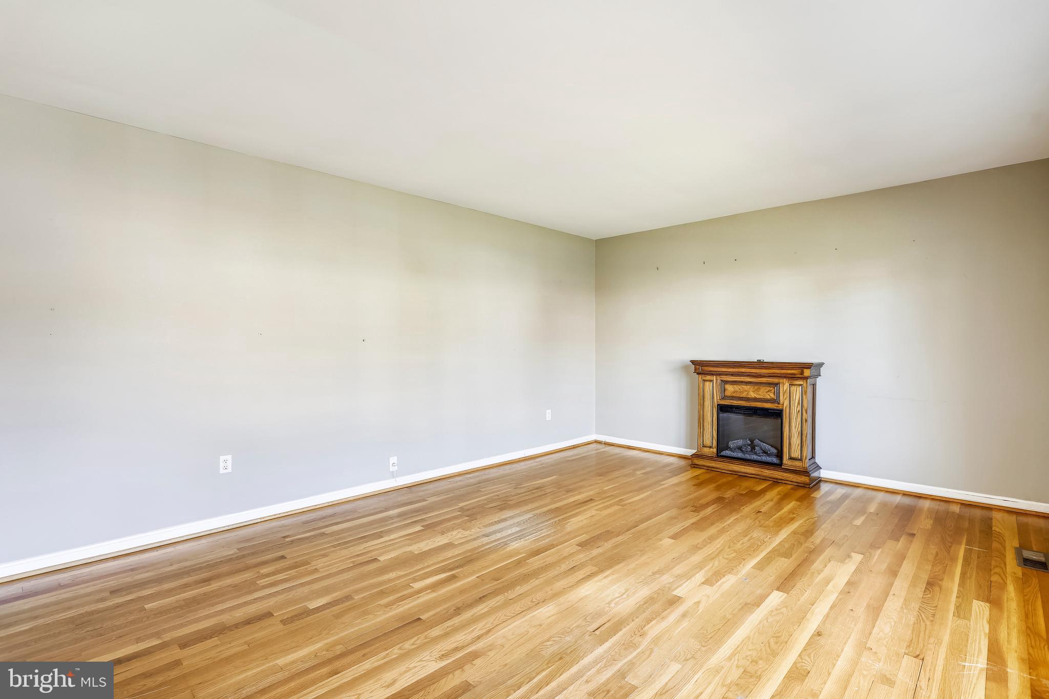 3728 Briars Road Olney, MD 20832 - Photo 8 of 54 a view of an empty room with wooden floor