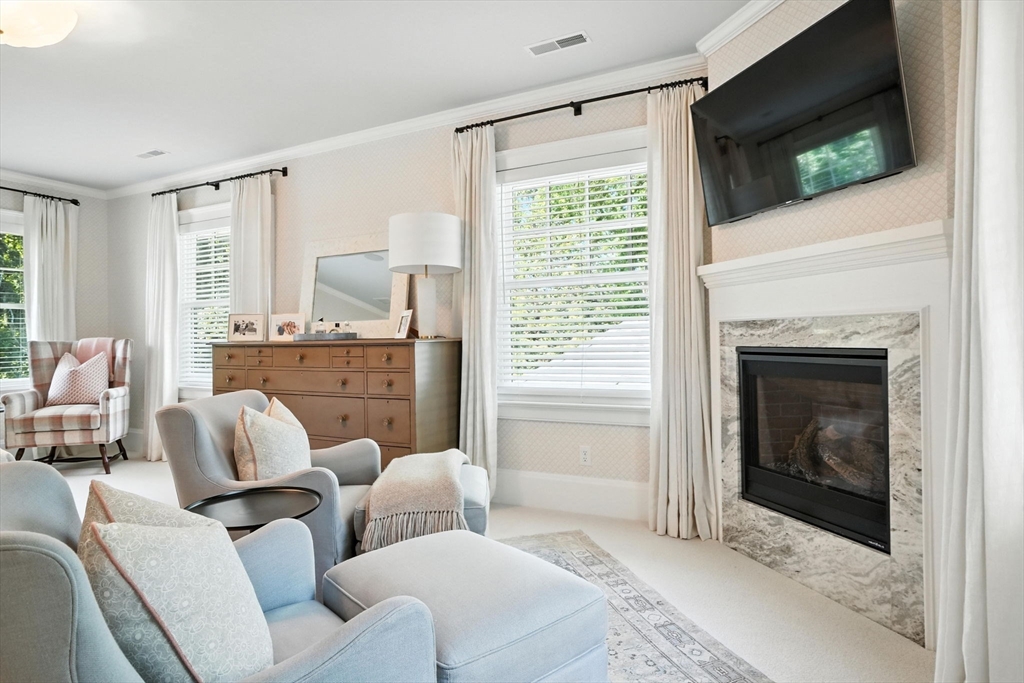 15 Winthrop Road Lexington, MA 02421 - Photo 23 of 39 a living room with furniture and a fireplace