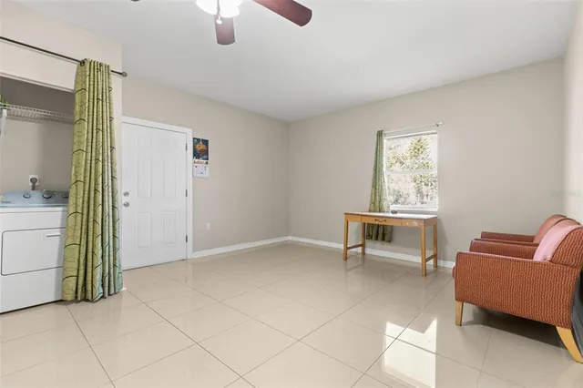 a view of kitchen with furniture and window