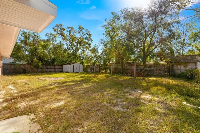 a view of a swimming pool with an outdoor space and seating area