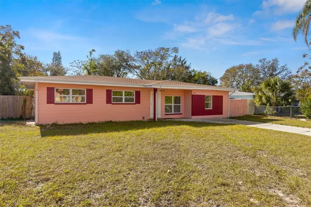 a view of a house with a yard