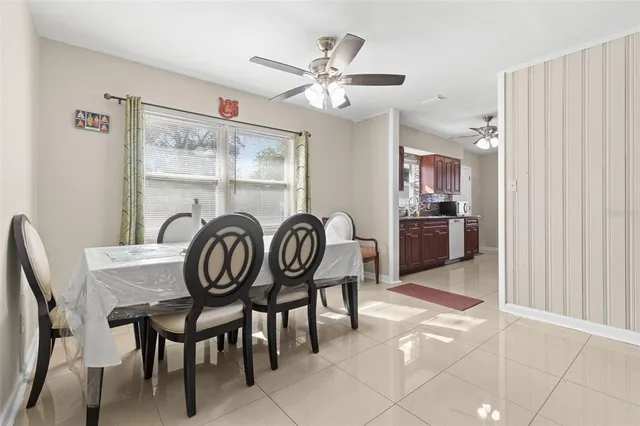 a dining room with furniture and window