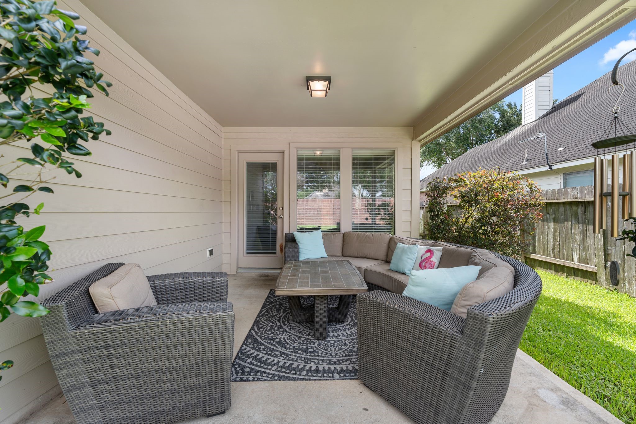 2606 Silverton Bend Rosenberg, TX 77471 - Photo 21 of 26 Just off the living room, the covered patio is perfect for al fresco dining, relaxing, or entertaining friends and family.