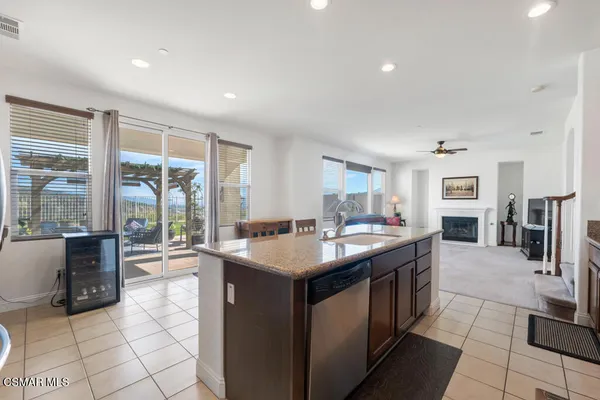 a kitchen with granite countertop a sink and counter top space
