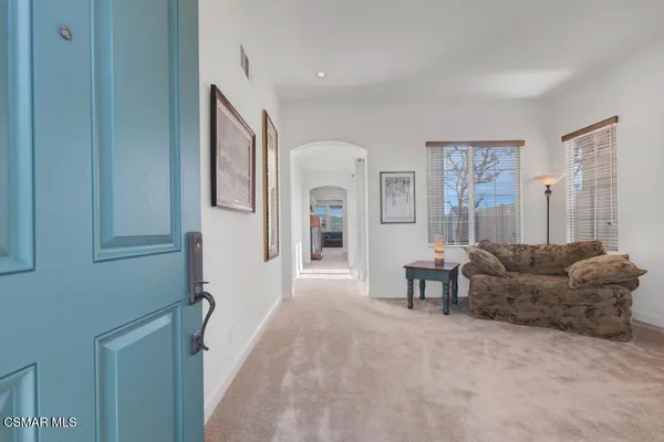 a living room with furniture and a couch