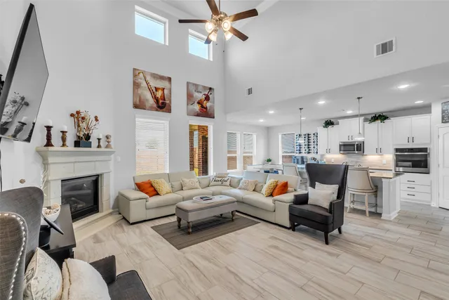 a living room with furniture and a fireplace