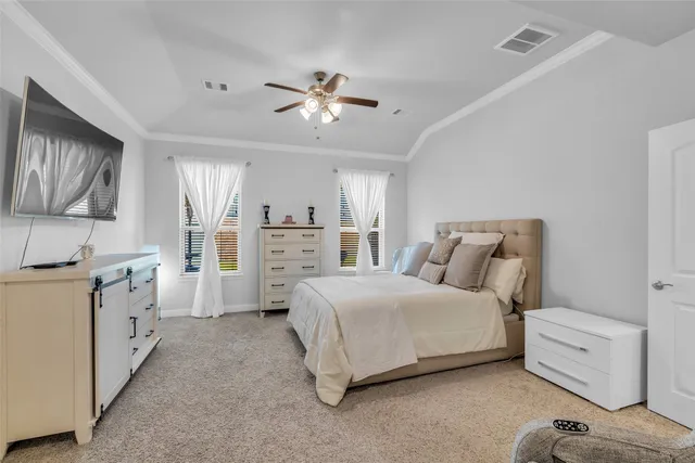 a large white kitchen with lots of counter space dining table and chairs