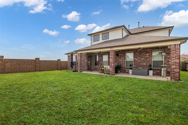 a view of a workspace with furniture and wooden floor