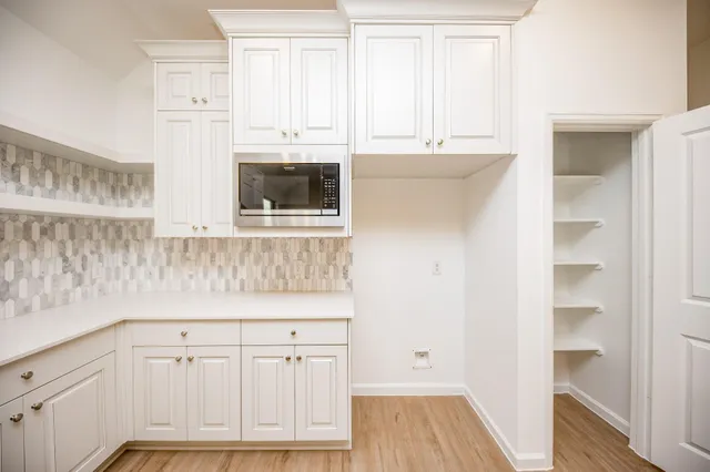 a view of cabinets with wooden floor and cabinets