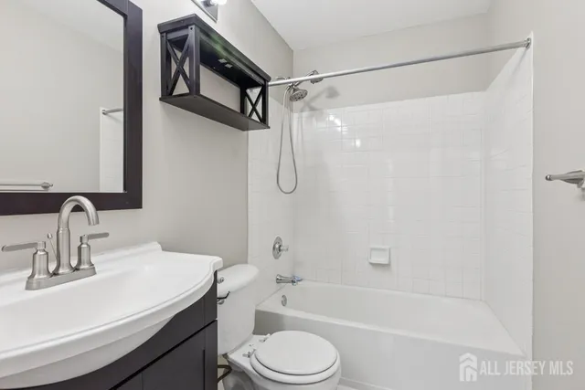 a bathroom with a sink toilet and a bathtub