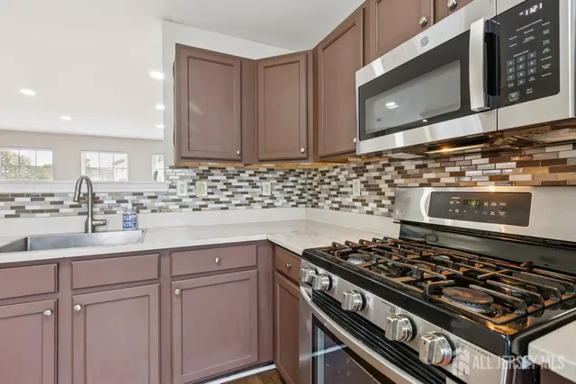 a kitchen with a stove and a sink