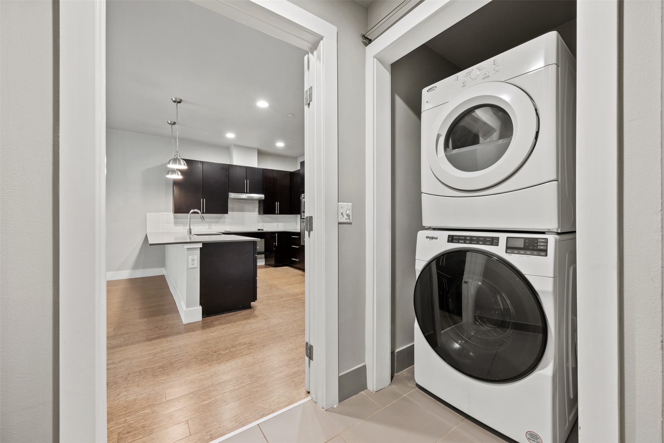 2804 Treble Lane, Unit 902 Austin, TX 78704 - Photo 22 of 31 a view of a kitchen with a washer and dryer