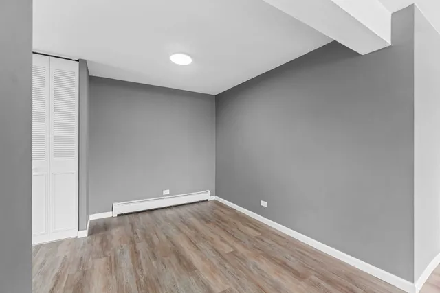 a view of room with wooden floor