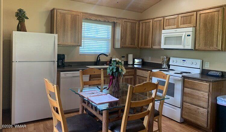 97 Rohrer Road Greer, AZ 85927 - Photo 9 of 14 a table and chairs in a kitchen