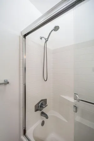 a bathroom with a shower and a bathtub