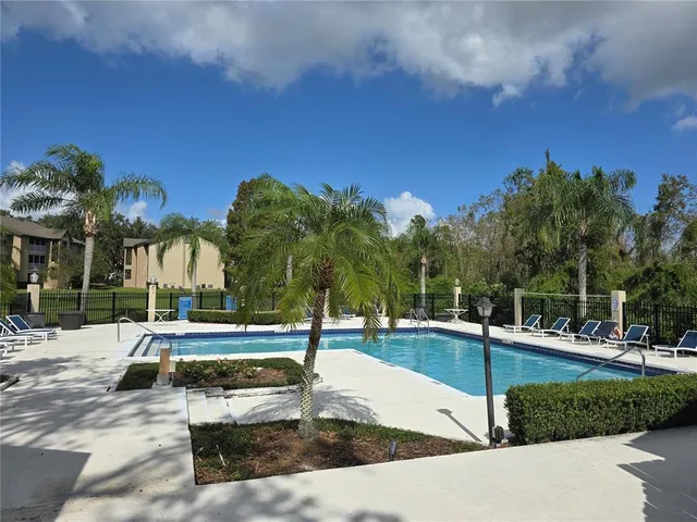 a view of a swimming pool with a patio
