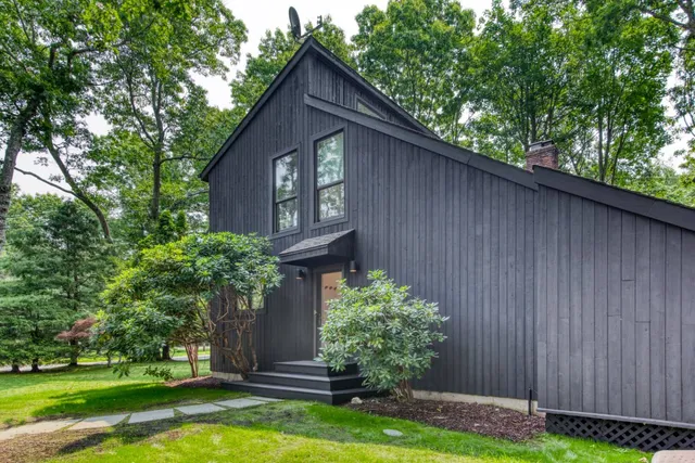 a front view of a house with garden