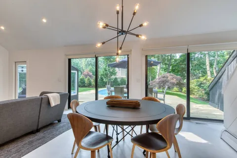 a view of a dining room with furniture window and outside view