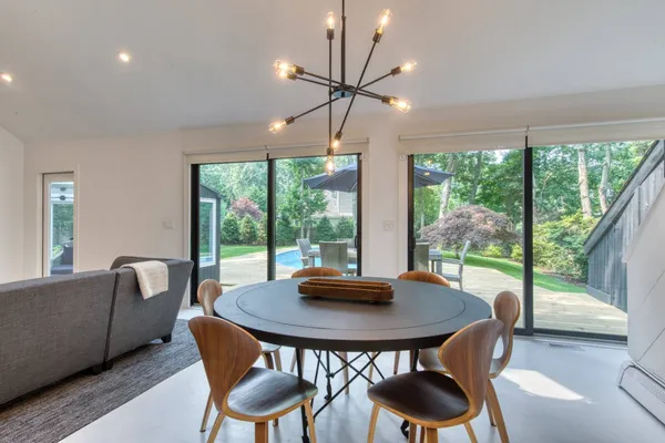 a view of a dining room with furniture window and outside view
