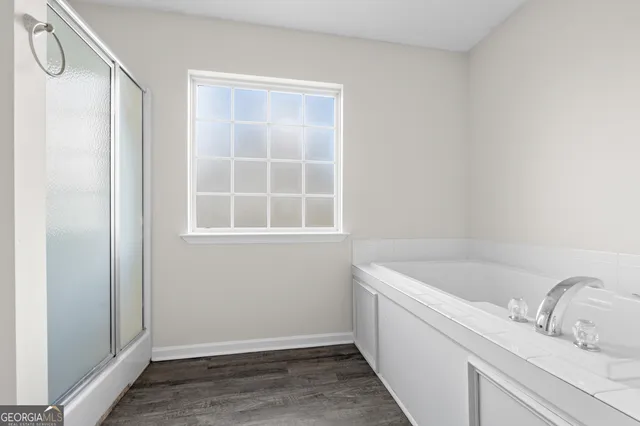 a bathroom with a bathtub and sink