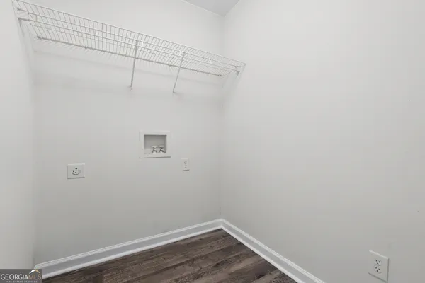 a view of a small space with racks on the wall