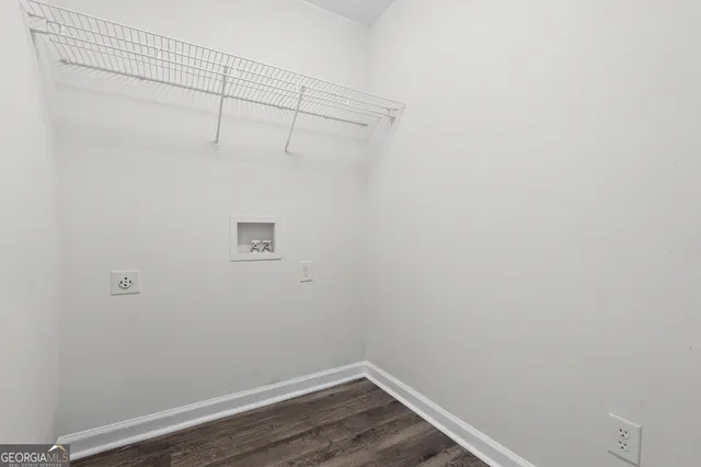 a view of a small space with racks on the wall