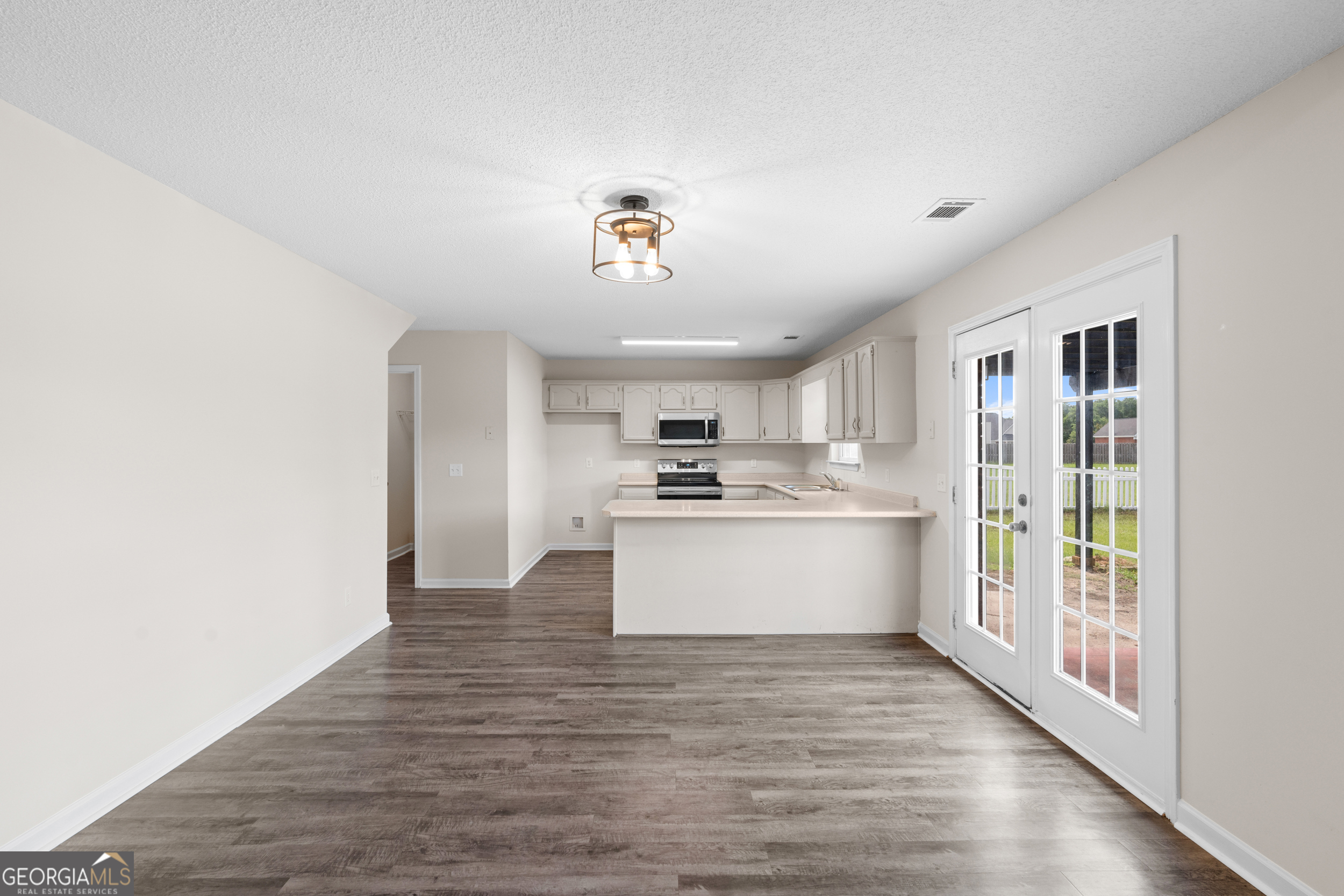 132 Teal Drive Springfield, GA 31329 - Photo 7 of 26 a view of a kitchen with a sink and wooden floor