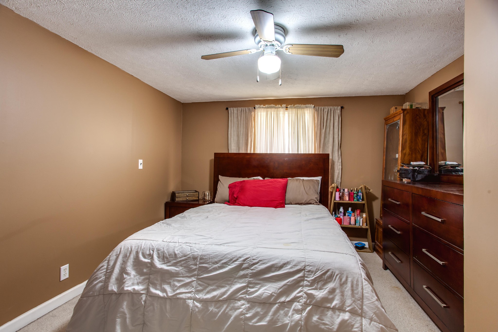 4332 Shipe Road Corryton, TN 37721 - Photo 15 of 25 a bedroom with a bed and a chandelier
