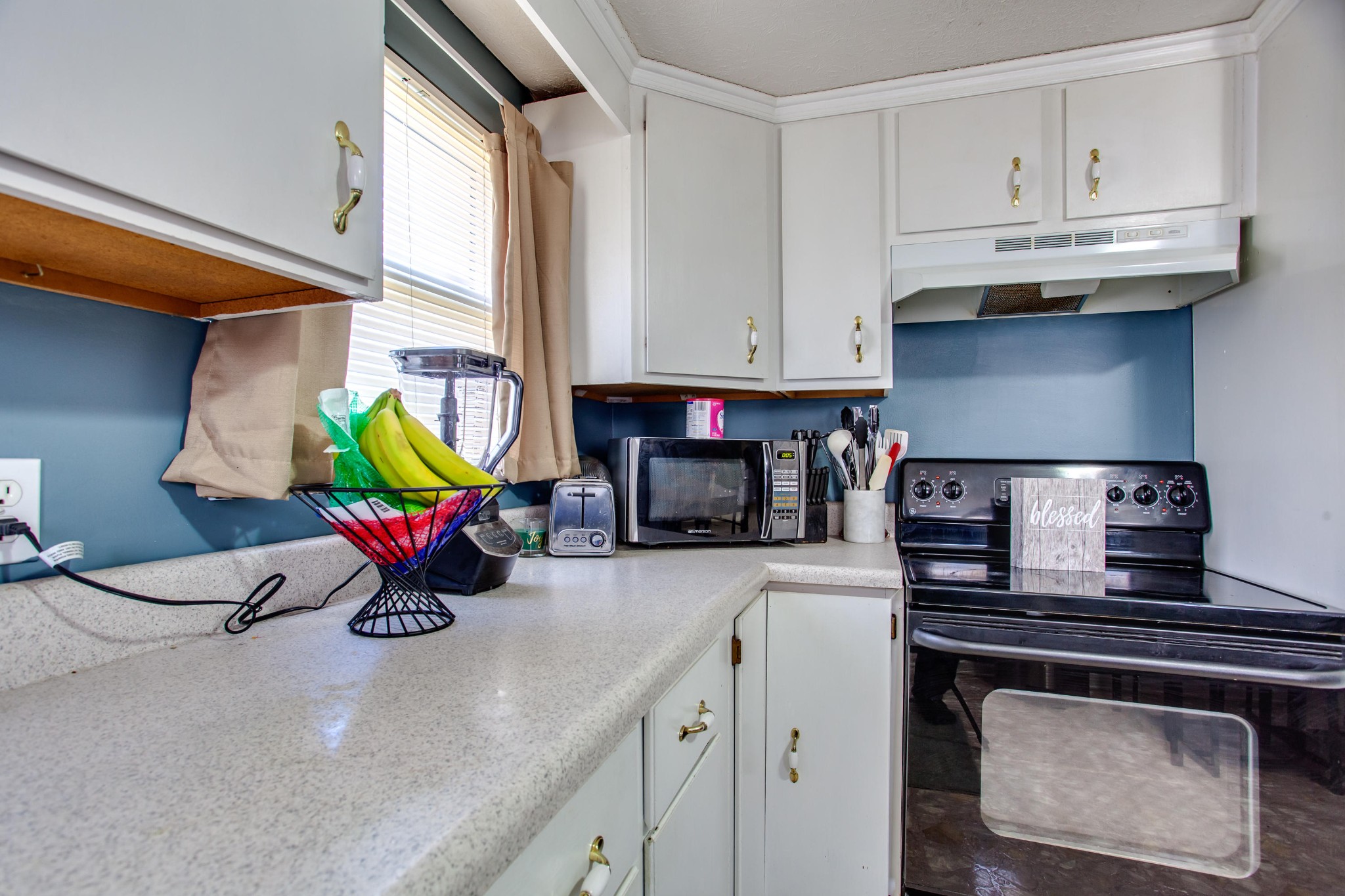 4332 Shipe Road Corryton, TN 37721 - Photo 8 of 25 a kitchen with a stove a sink and a refrigerator