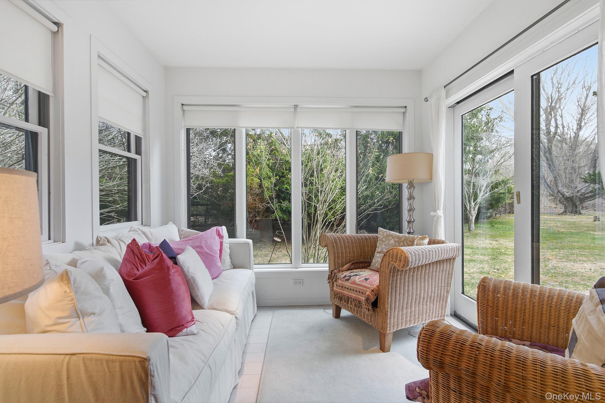 60 Skimhampton Road East Hampton, NY 11937 - Photo 30 of 37 a living room with furniture and a large window