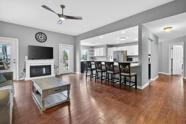 a large kitchen with kitchen island granite countertop a sink and dishwasher