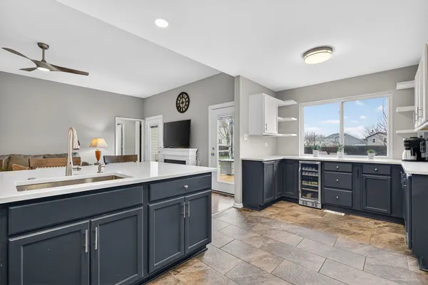 a view with cabinets a sink and a stove in it